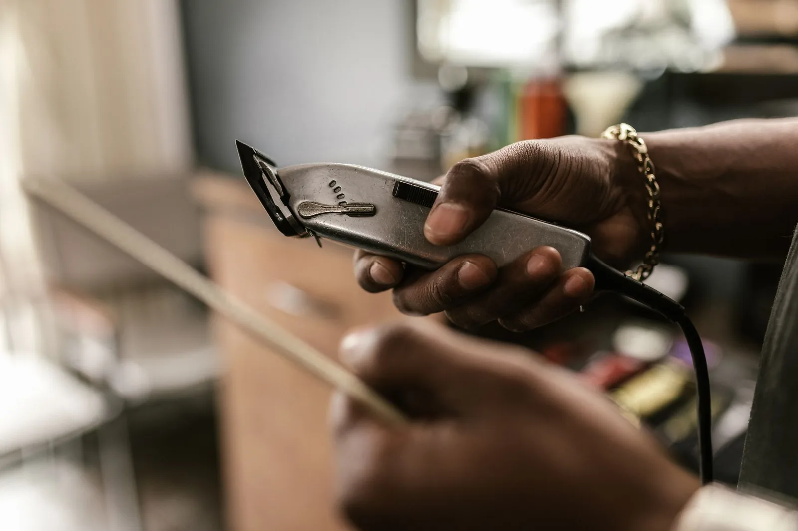 Barber holding a trimmer in a barbershop